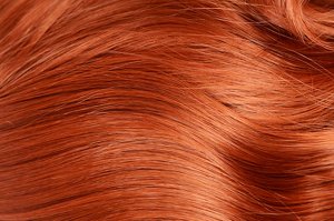 Close up of a swatch of natural-looking copper hair